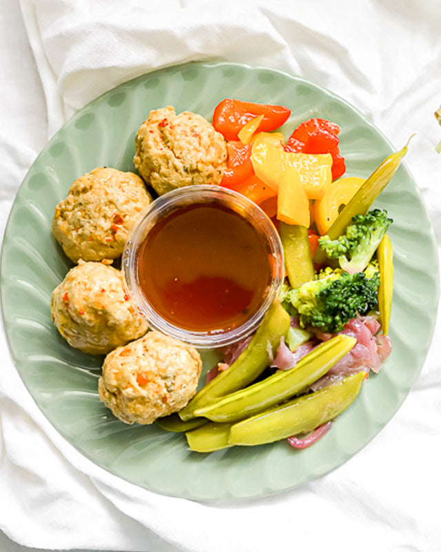 Meals - General Tsao Style Pork Balls Over Mixed Veggies & Rice Noodles